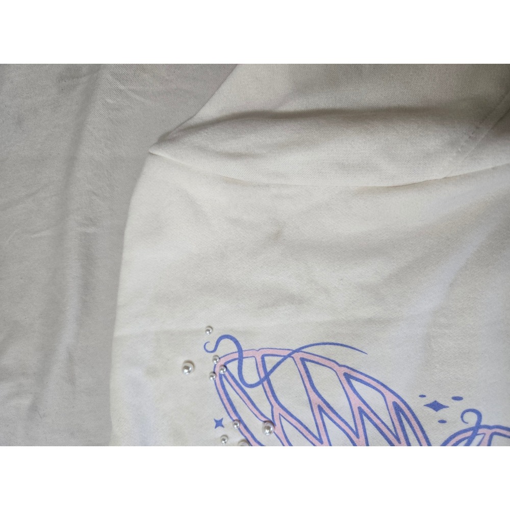 Wicked Movie Butterfly Pearl Graphic Sweatshirt Cream XXS 5UWT01OGLC NWT - Picture 7 of 10